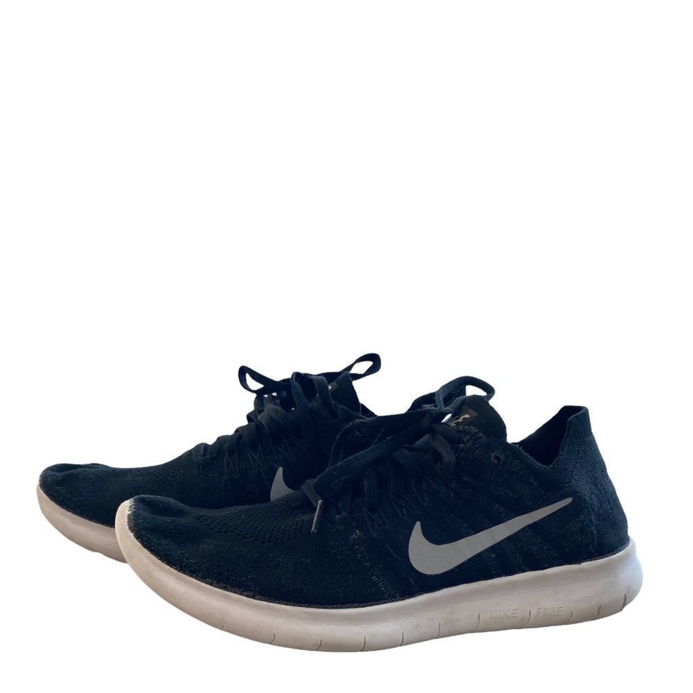 Nike black white lace up sneakers size 6.5Y. Fits adult size 7